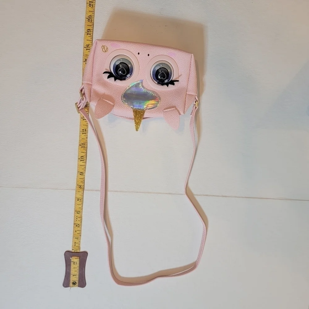 Purse pets pink purse. For 5 yr Olds plus. Comes with batteries and instructions